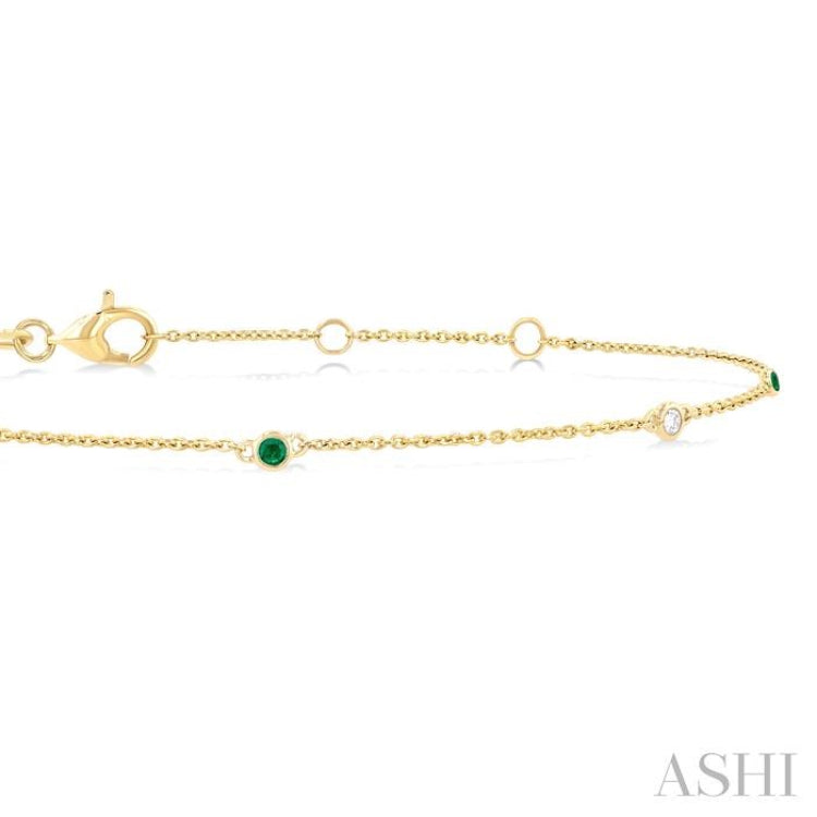 1.75 MM Emerald and 1/20 Ctw Round Cut Diamond Precious Station Bracelet in 14K Yellow Gold