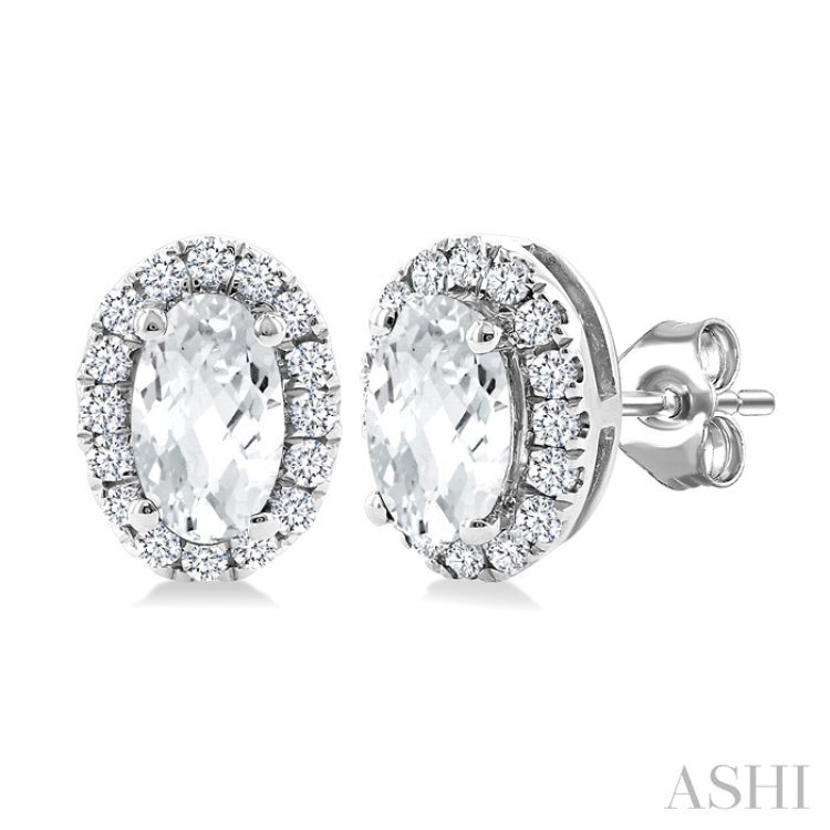5x3 MM Oval Shape White Topaz and 1/8 Ctw Round Cut Diamond Halo Semi-Precious Stud Earrings in 14K White Gold