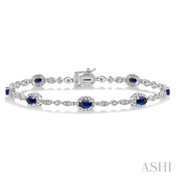 5x3 MM Oval Cut Sapphire and 1/20 Ctw Round Cut Diamond Bracelet in 10K White Gold