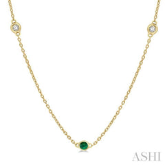 1.75 MM Emerald and 1/6 Ctw Round Cut Diamond Precious Station Necklace in 14K Yellow Gold