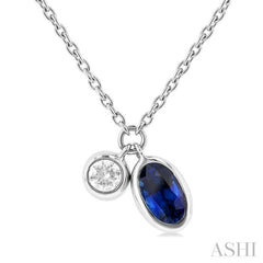 5x3 MM Oval Cut Sapphire and 1/50 Ctw Bezel Set Round Cut Diamond Precious Pendant With Chain in 10K White Gold