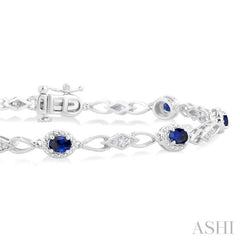1/20 Ctw Oval Cut 4X3MM Sapphire and Round Cut Diamond Precious Fashion Bracelet in 10K White Gold